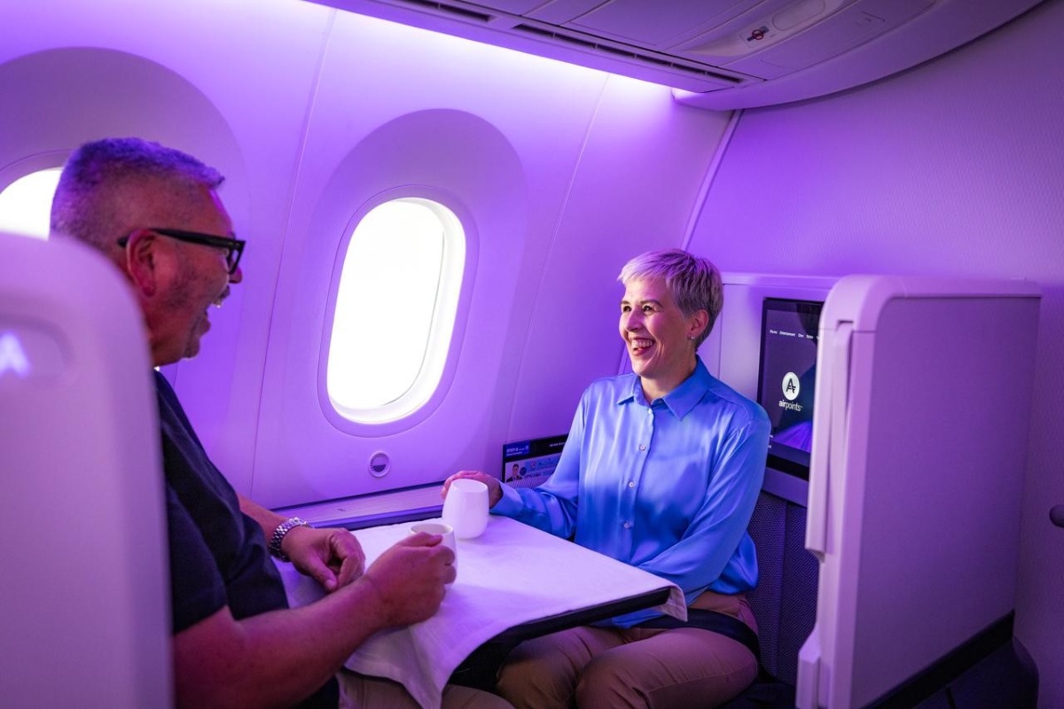 Passengers dining together in Air New Zealand's Business Premier Luxe suite