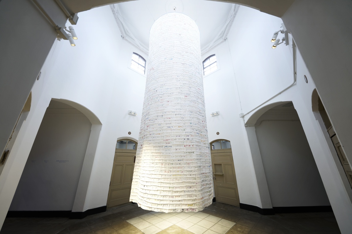 Sewing Voices installation at Nara Prison Museum, poems by former inmates embroidered onto hanging cloth