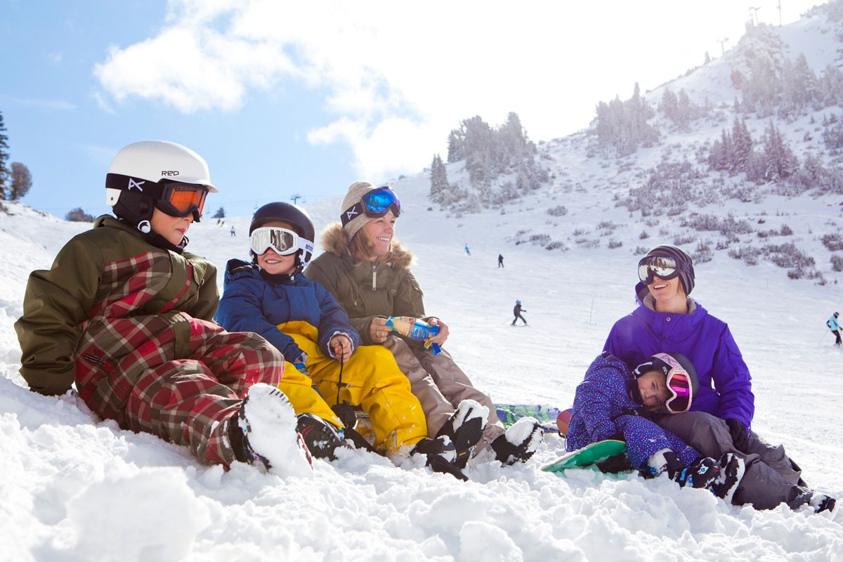 Family sitting on the mountain in Mammoth